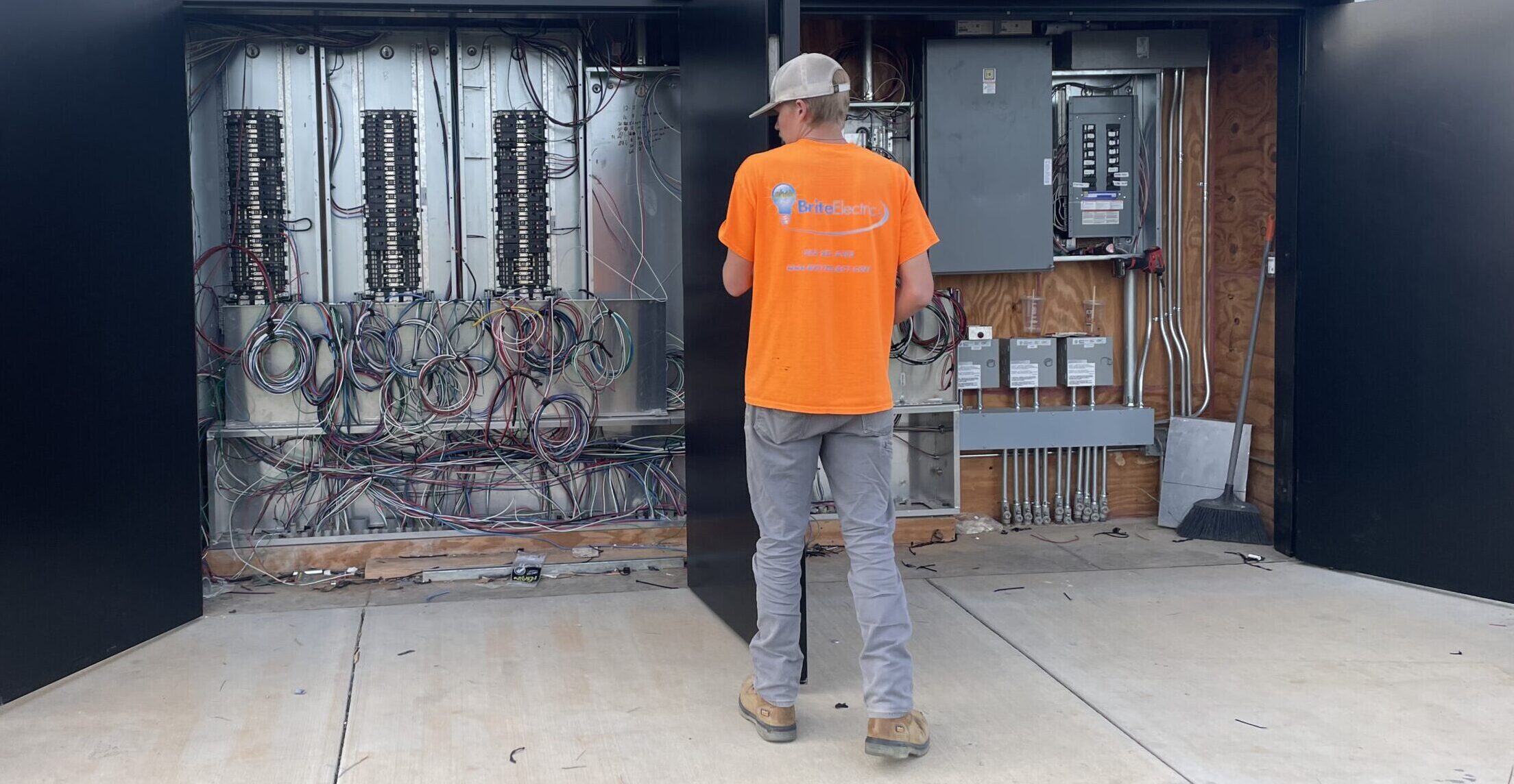Brite Electric Team in front of a generator